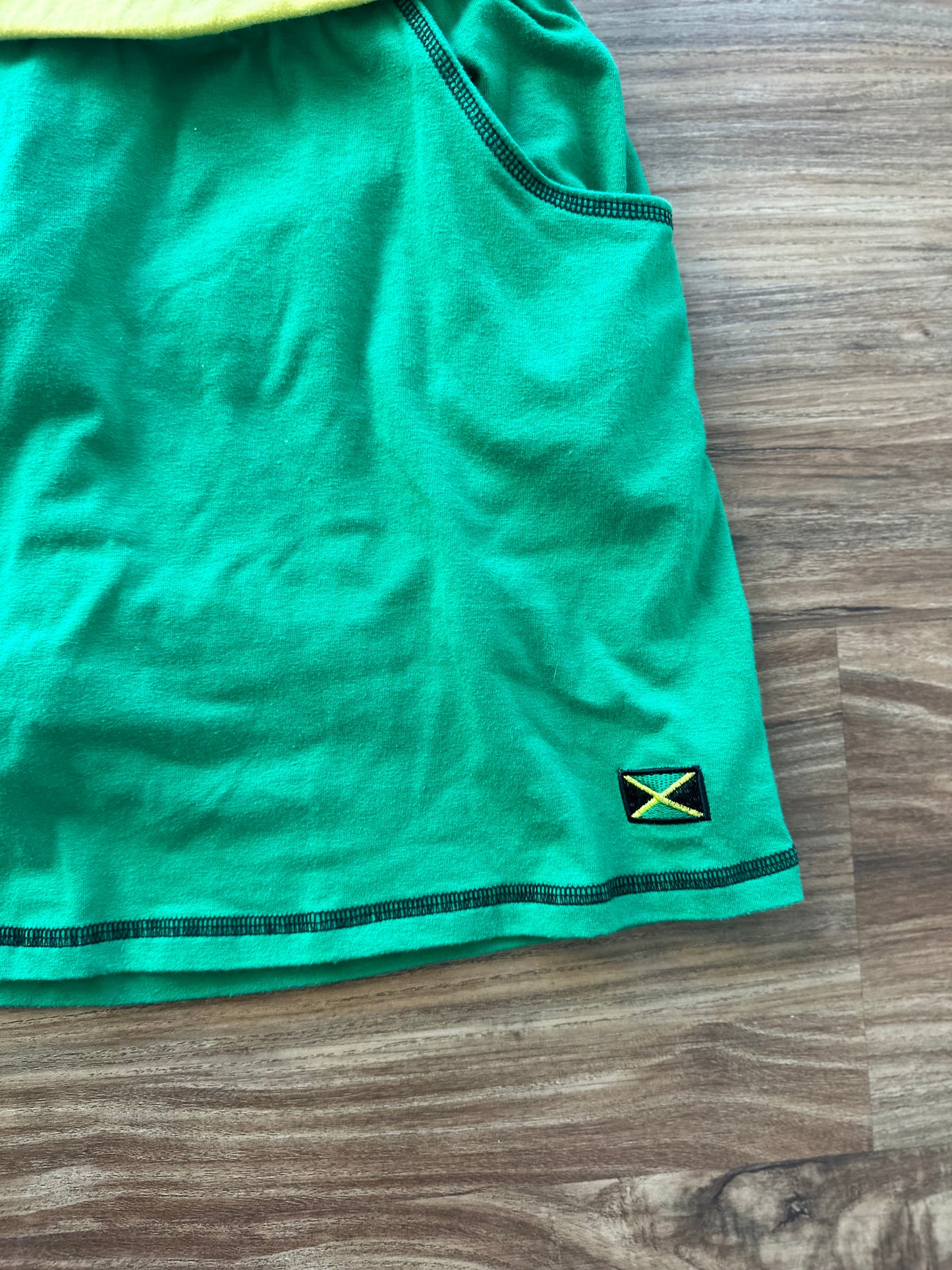 Vintage 2000s green “Jamaica” fitted mini skirt