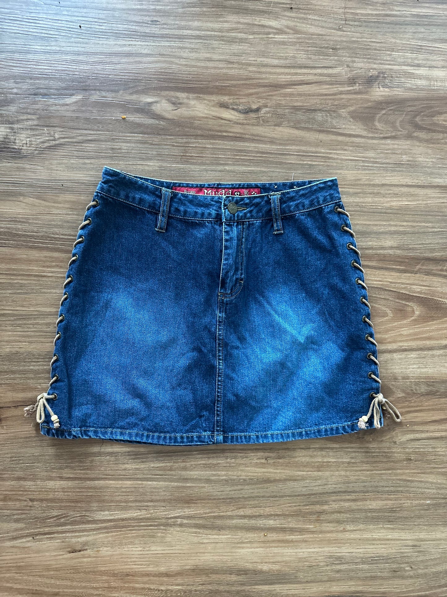 Vintage 2000s dark denim miniskirt with brown ties on sides