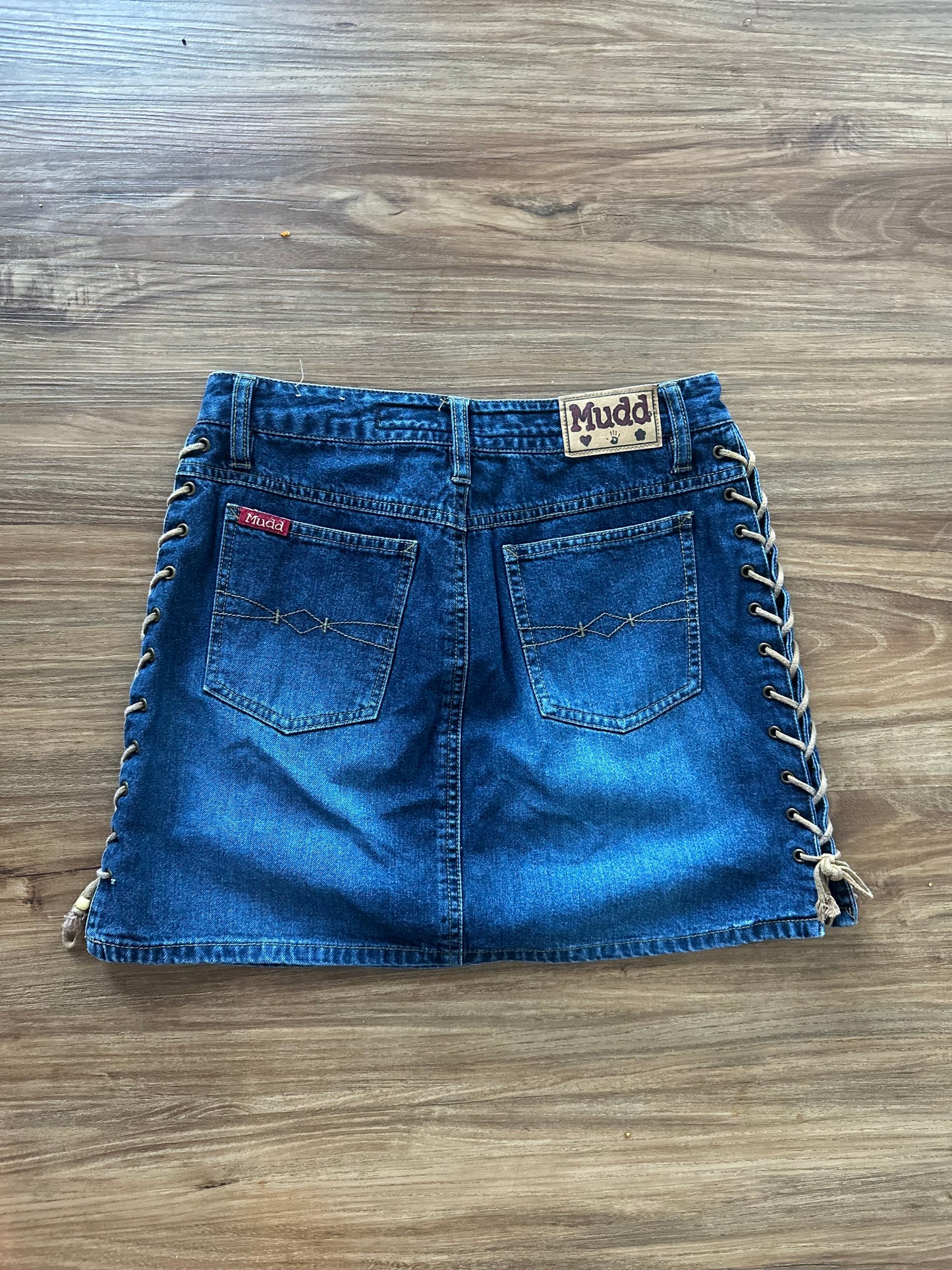 Vintage 2000s dark denim miniskirt with brown ties on sides