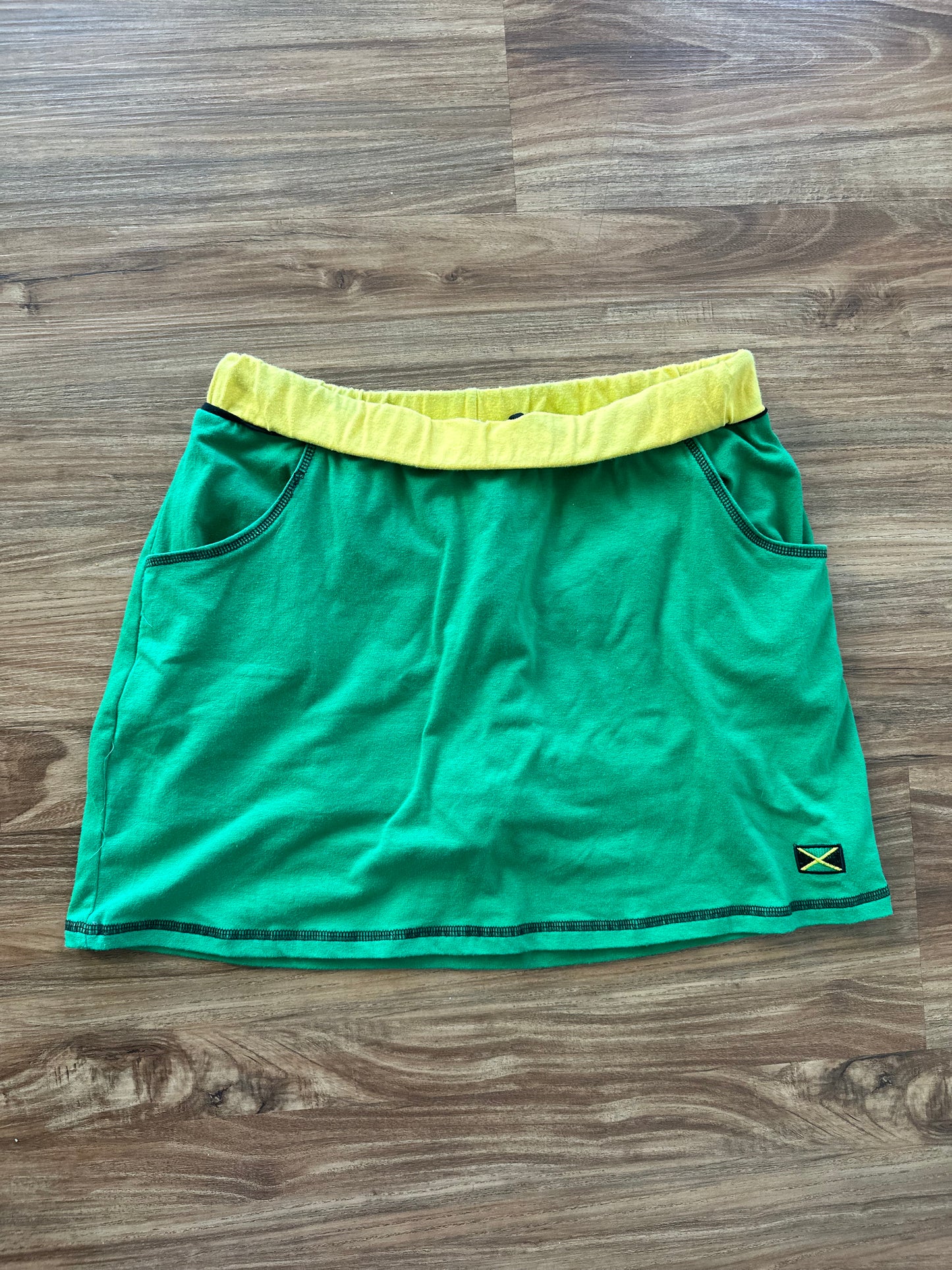 Vintage 2000s green “Jamaica” fitted mini skirt